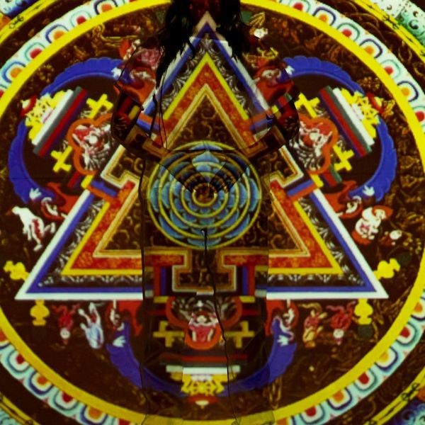 A coral colored symbol representing vibrant energy and well-being.